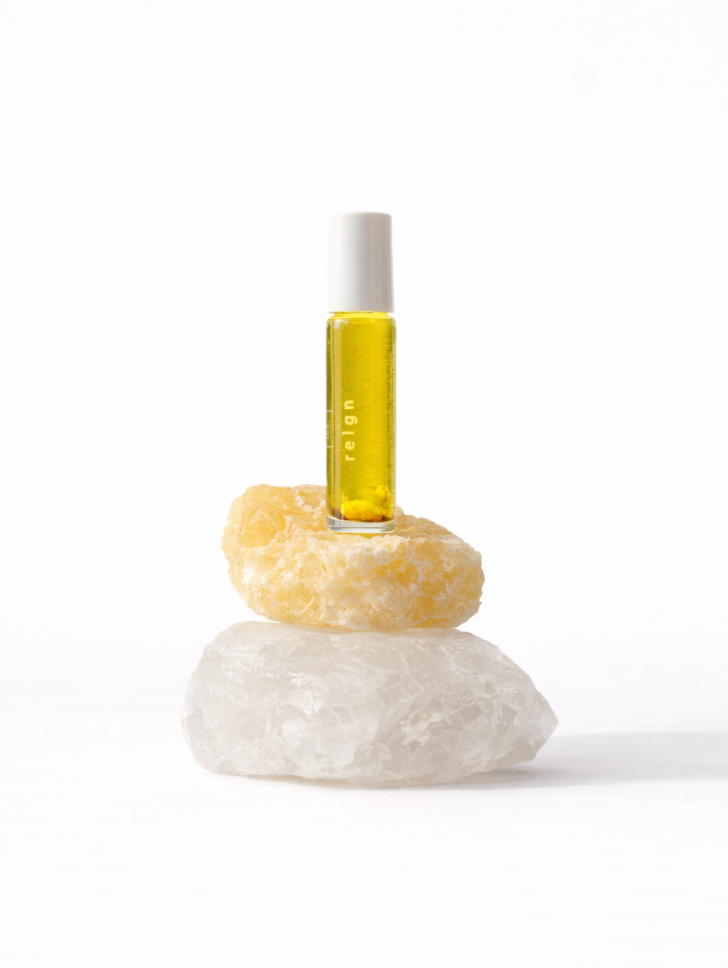 1331_reign_botanical_perfume_roll_on on citrine crystal